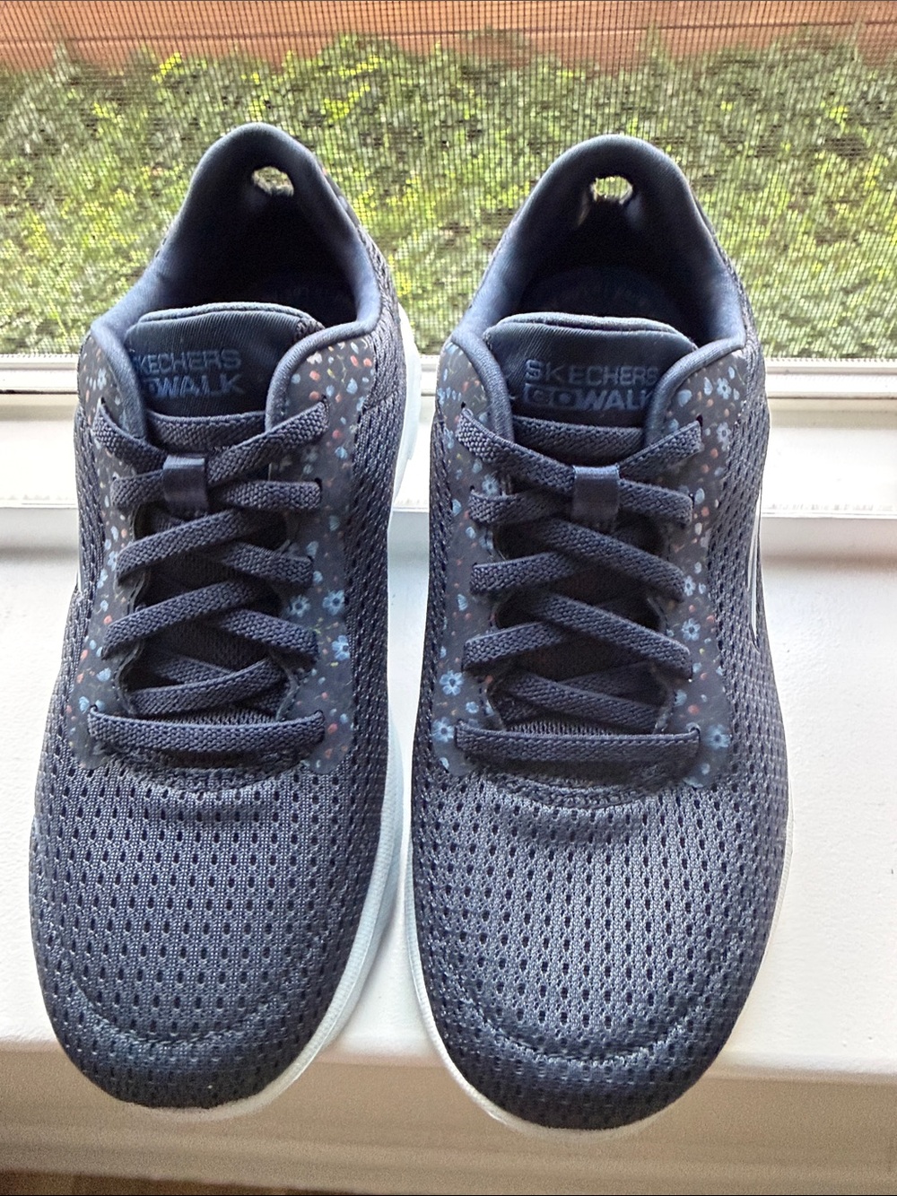 Skechers Navy Knit Walking Sneakers with Subtle Floral Accents.
